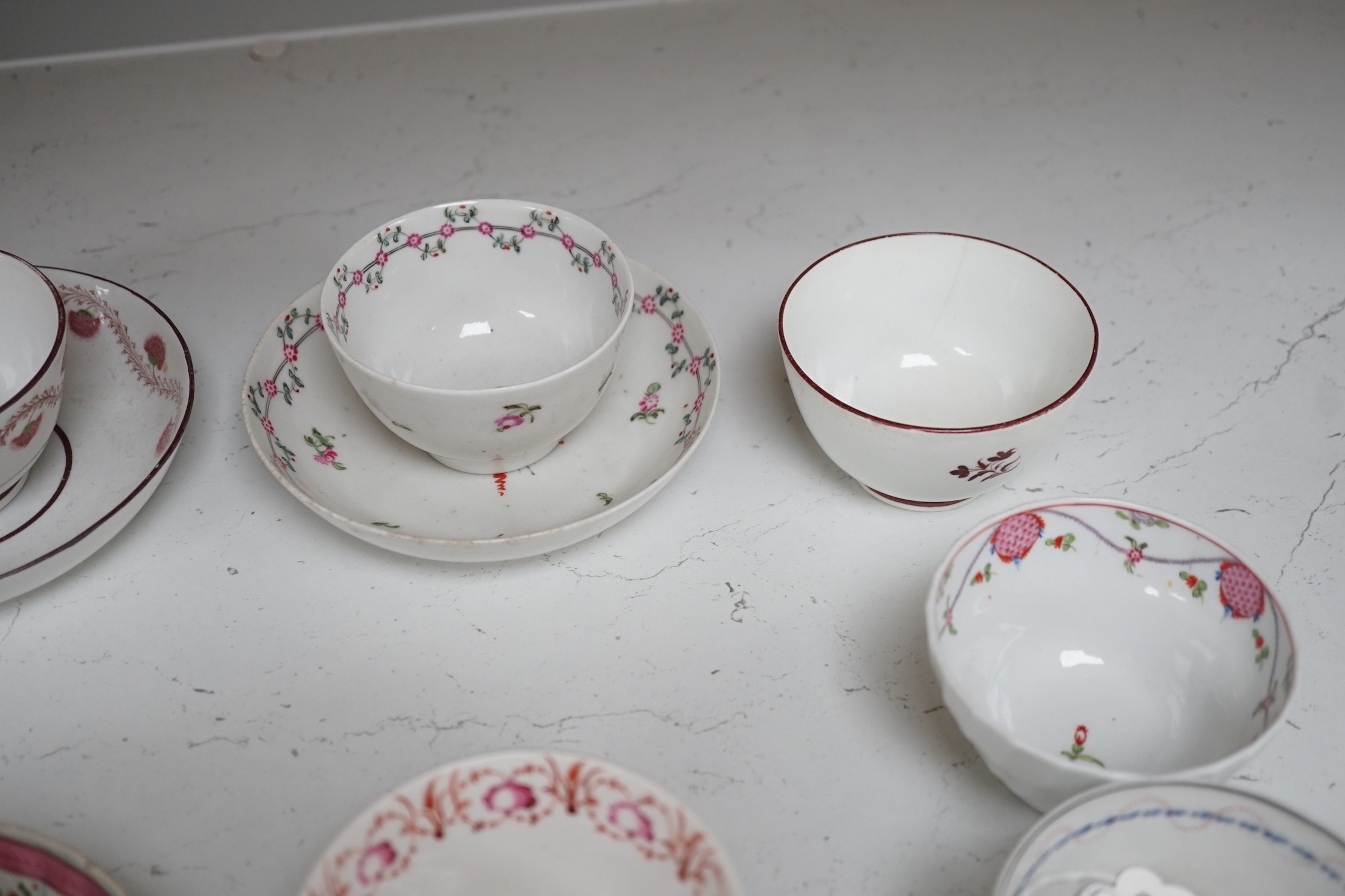 A quantity of Newhall teabowls and saucers and a pearlware tea bowl and saucer, c.1790-1800